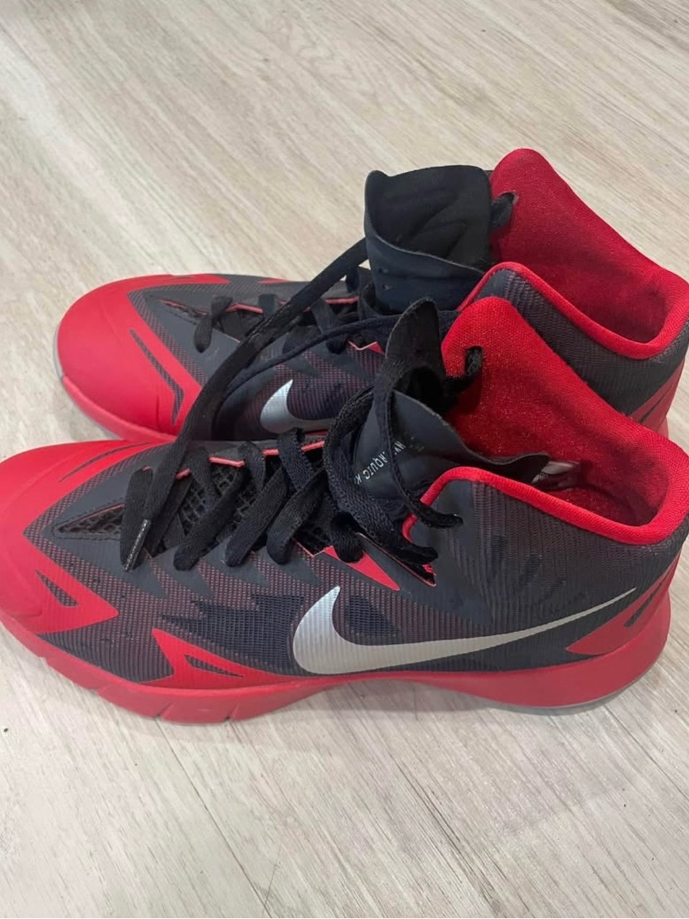 Nike Red and Black Men's Athletic Basketball Shoes with Silver Swoosh